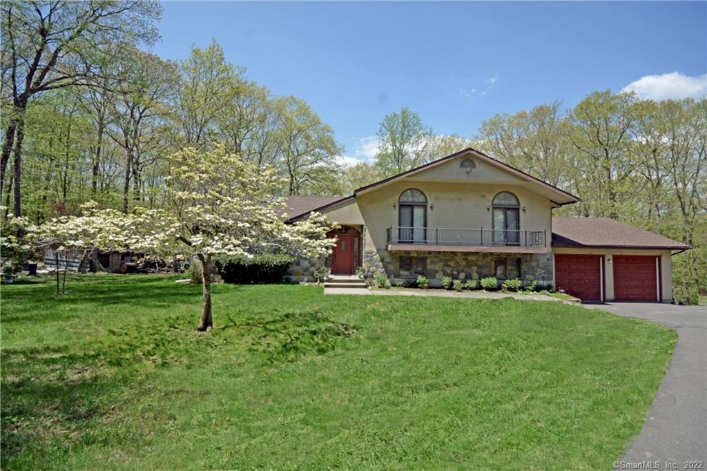 46 Northrop Road Bethany, CT 06524 - Photo 1 of 1 Front view - Stone and stucco Split Level home, Well suited for Mom and Dad to live with you should the need arise . Circular Drive way wraps around Professional landscaped garden area.