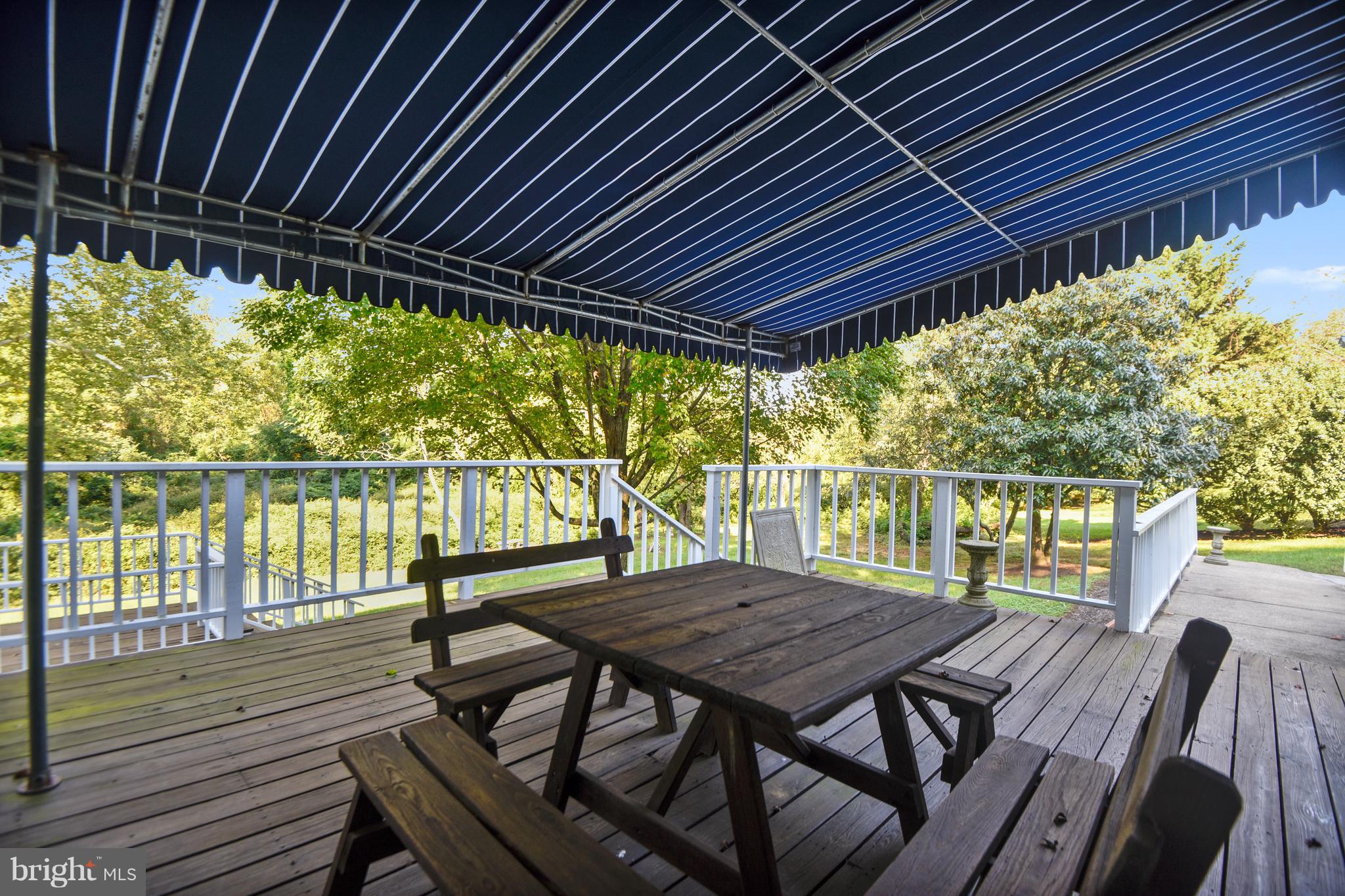 1800 Hidden Point Road Annapolis, MD 21409 - Photo 24 of 30 Deck with awning overlooking property