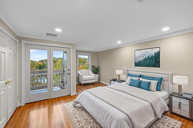 a bedroom with a large bed and a large window