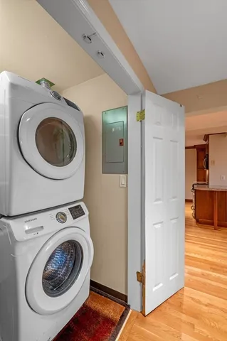 a utility room with sink dryer and washer
