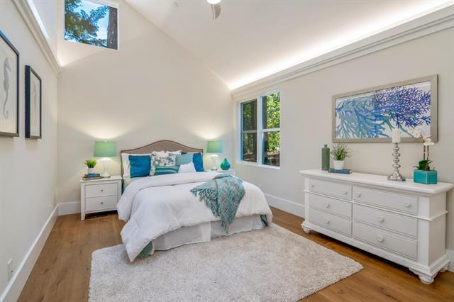 110 Stadler Drive Woodside, CA 94062 - Photo 14 of 27 a bedroom with a bed and a painting on the wall