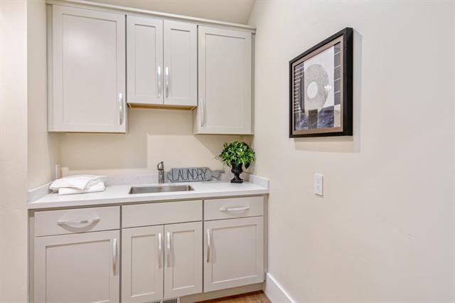 110 Stadler Drive Woodside, CA 94062 - Photo 17 of 27 a kitchen with a sink and cabinets