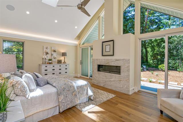 110 Stadler Drive Woodside, CA 94062 - Photo 18 of 27 a bedroom with furniture and a fireplace