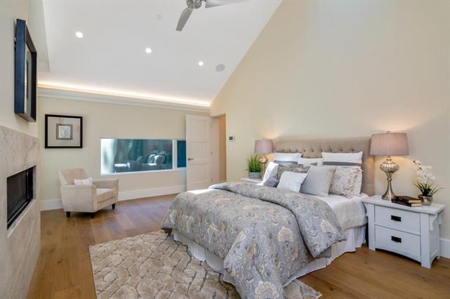 110 Stadler Drive Woodside, CA 94062 - Photo 19 of 27 a spacious bedroom with a bed and wooden floor