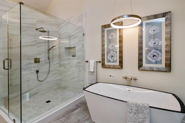 110 Stadler Drive Woodside, CA 94062 - Photo 20 of 27 a bathroom with a tub a sink and mirror