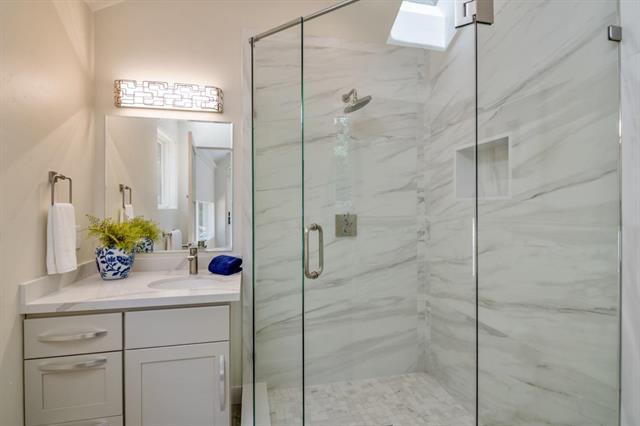 110 Stadler Drive Woodside, CA 94062 - Photo 25 of 27 a bathroom with a shower sink and mirror