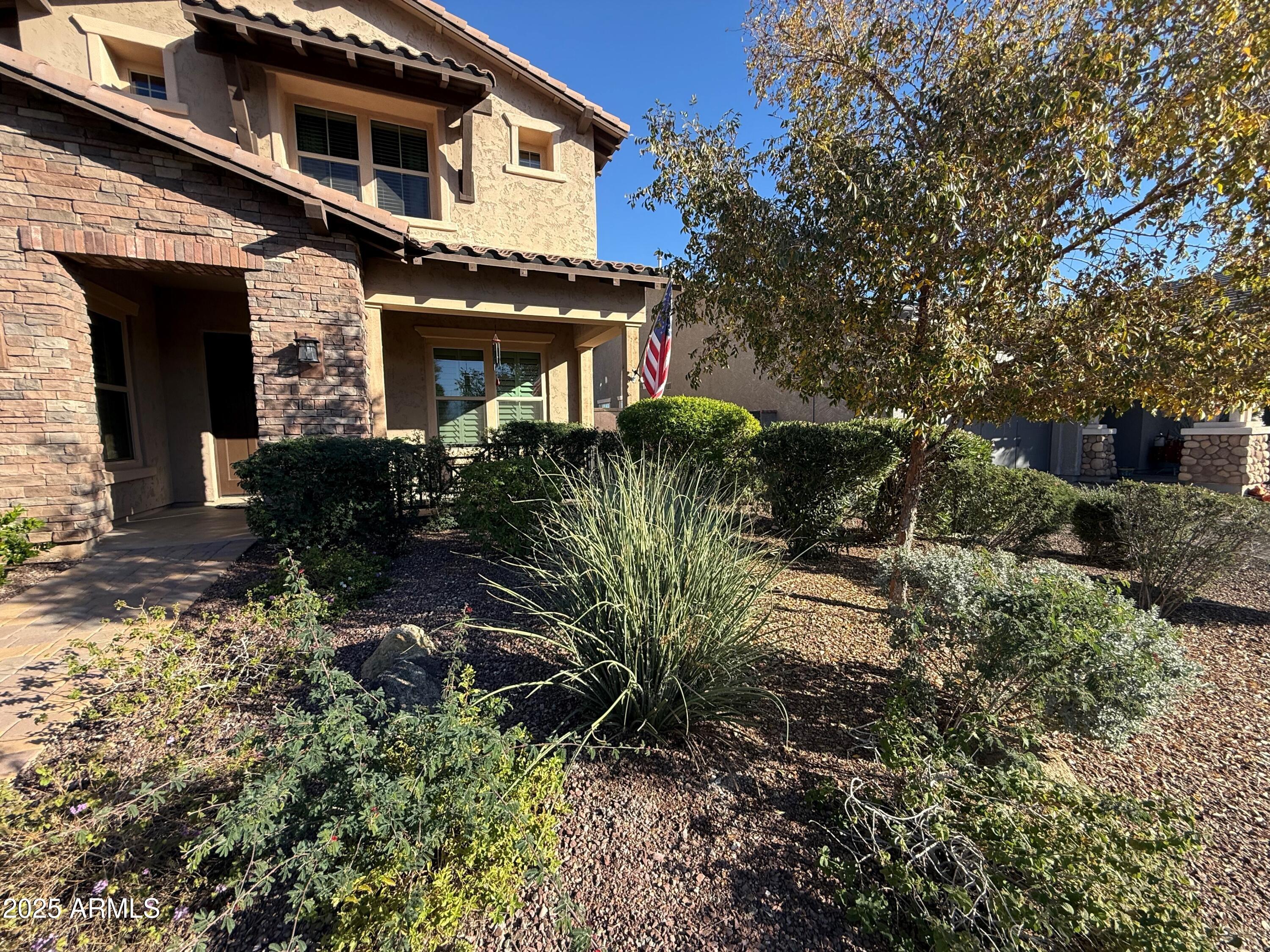 2709 North Black Rock Road Buckeye, AZ 85396 - Photo 2 of 74 a front view of a house with a yard