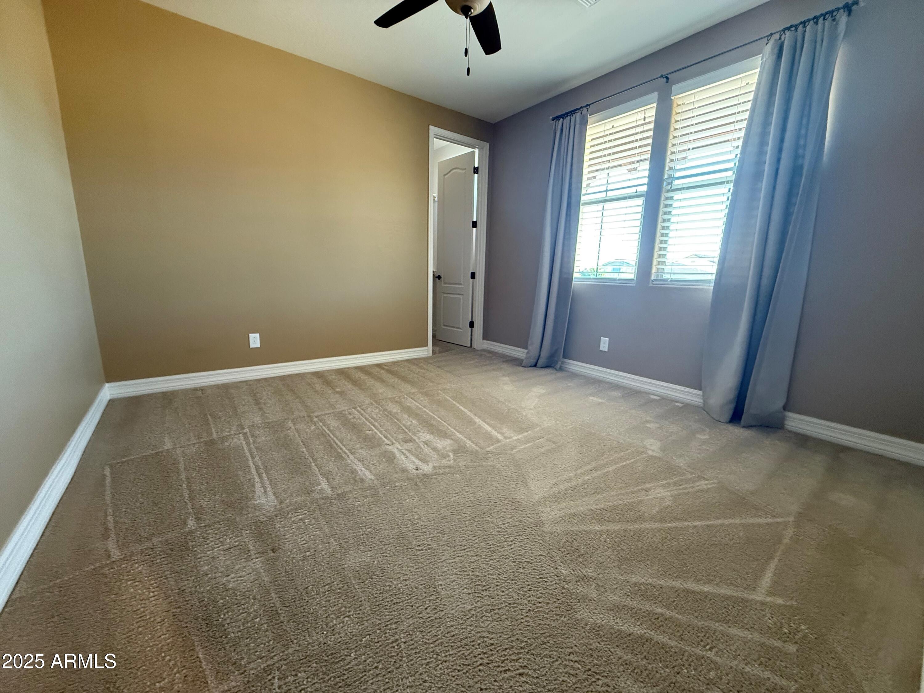 2709 North Black Rock Road Buckeye, AZ 85396 - Photo 40 of 74 a view of an empty room with a window