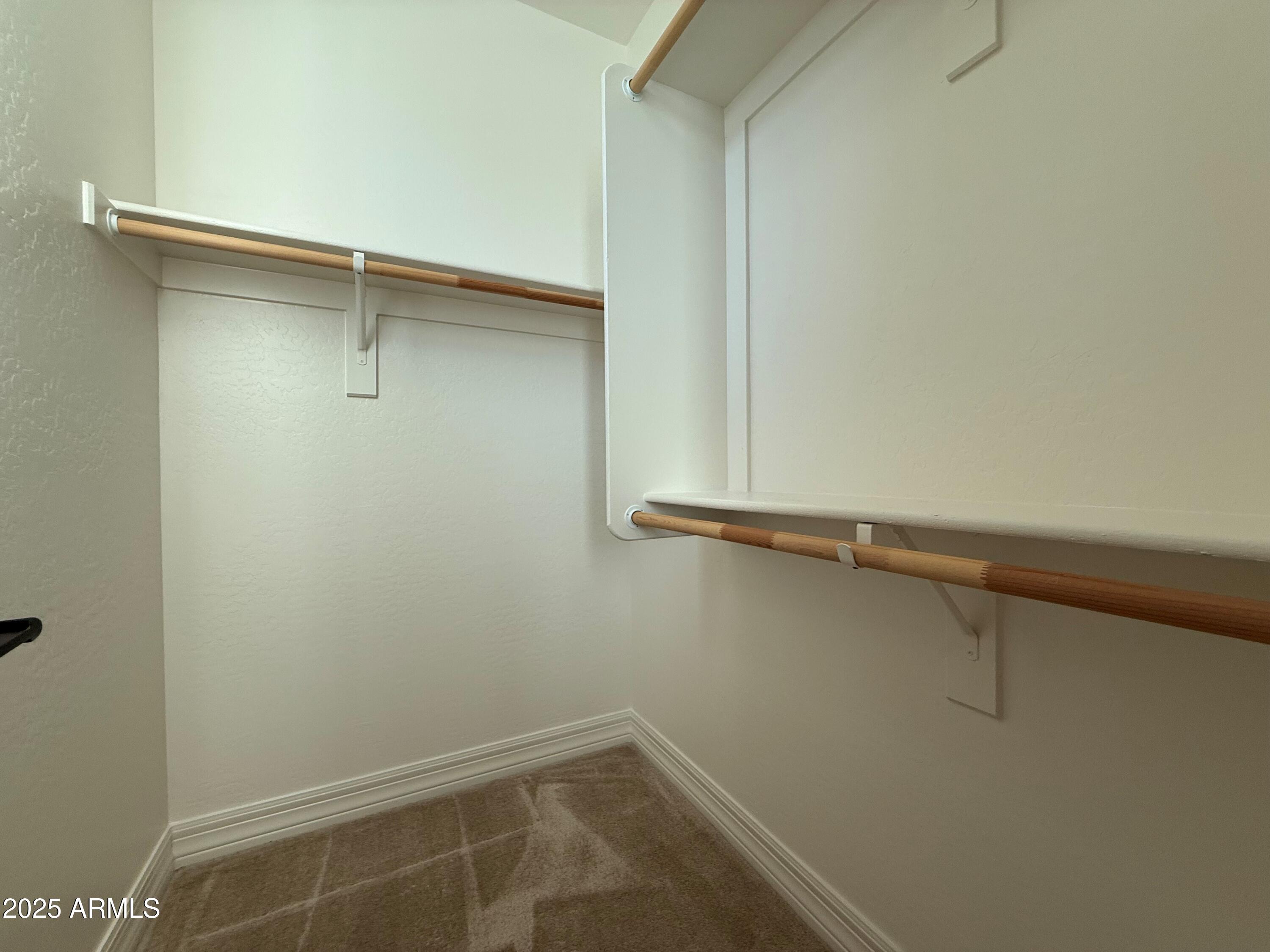 2709 North Black Rock Road Buckeye, AZ 85396 - Photo 43 of 74 a view of a room with shelf on the wall