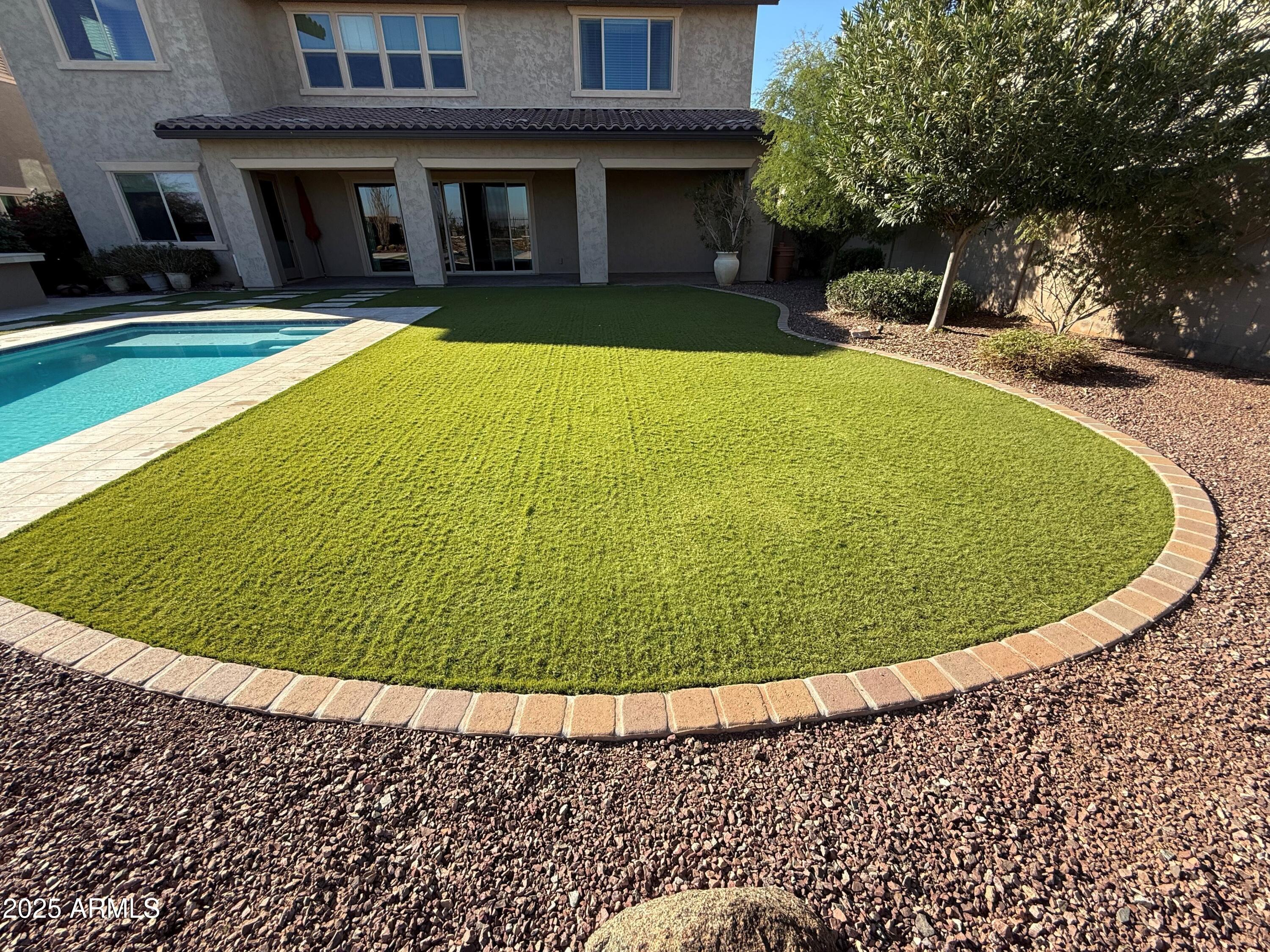 2709 North Black Rock Road Buckeye, AZ 85396 - Photo 65 of 74 a view of outdoor space swimming pool and outdoor seating