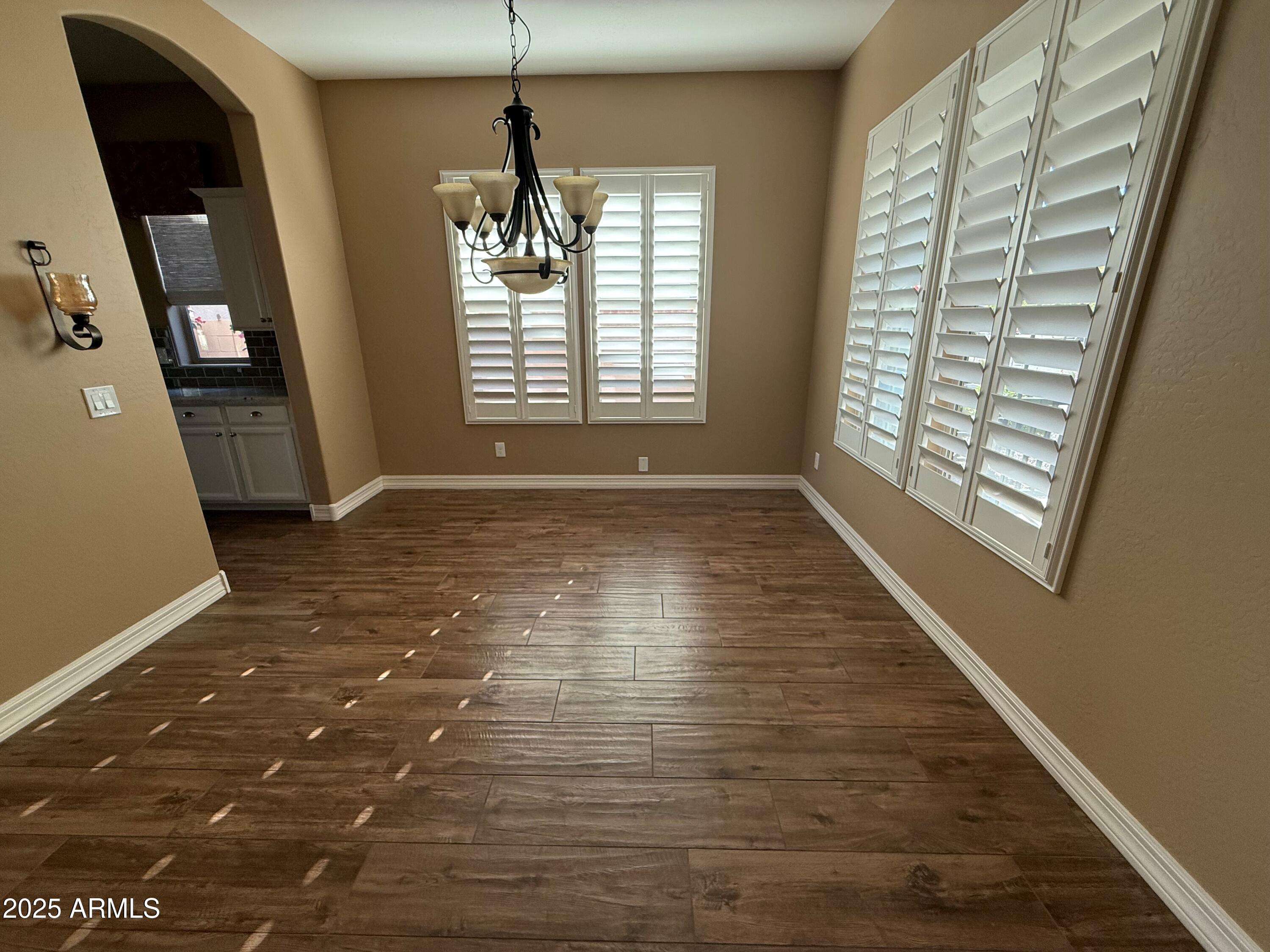 2709 North Black Rock Road Buckeye, AZ 85396 - Photo 7 of 74 a view of an empty room with a window