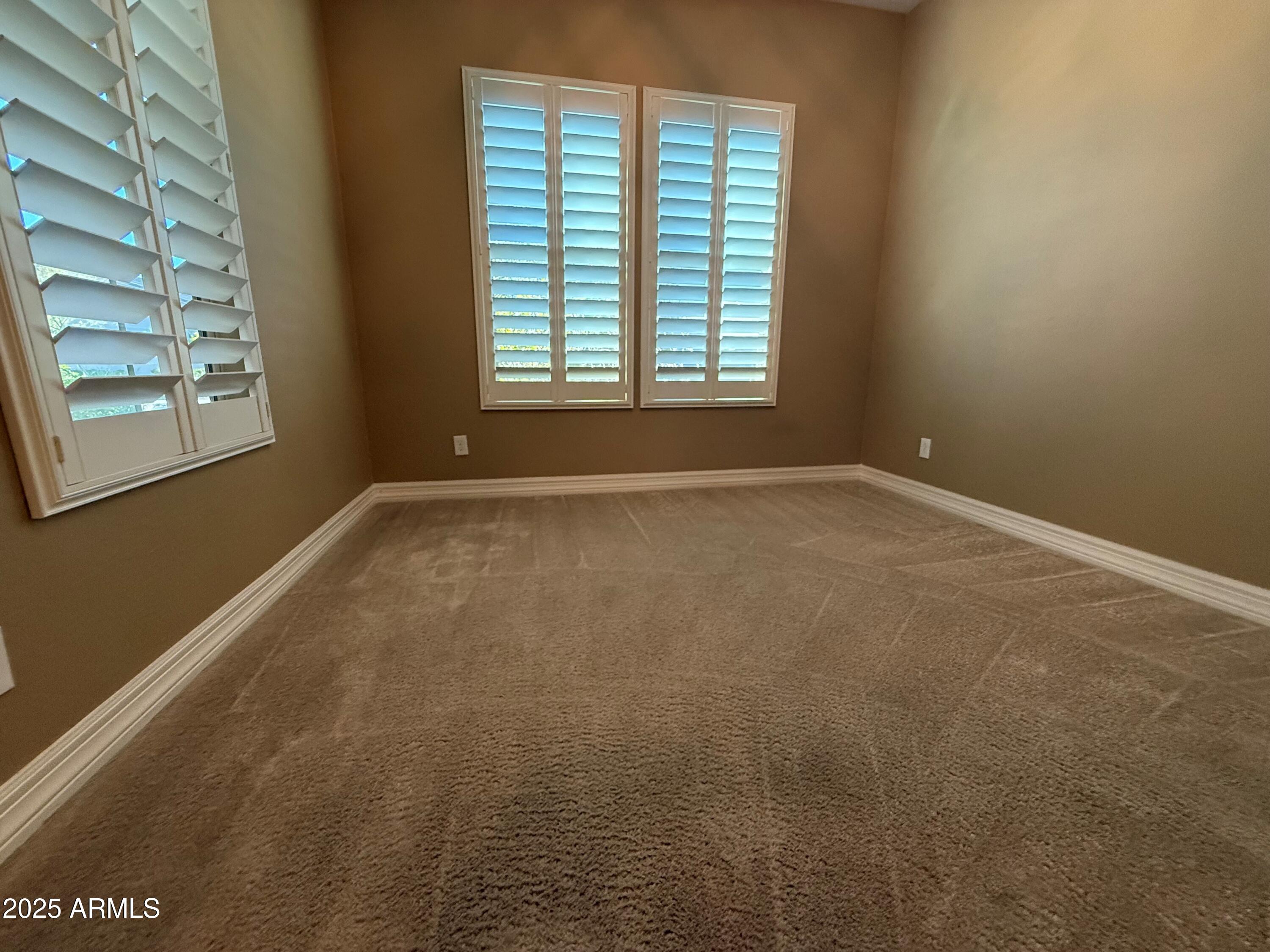 2709 North Black Rock Road Buckeye, AZ 85396 - Photo 10 of 74 a view of an empty room with a window
