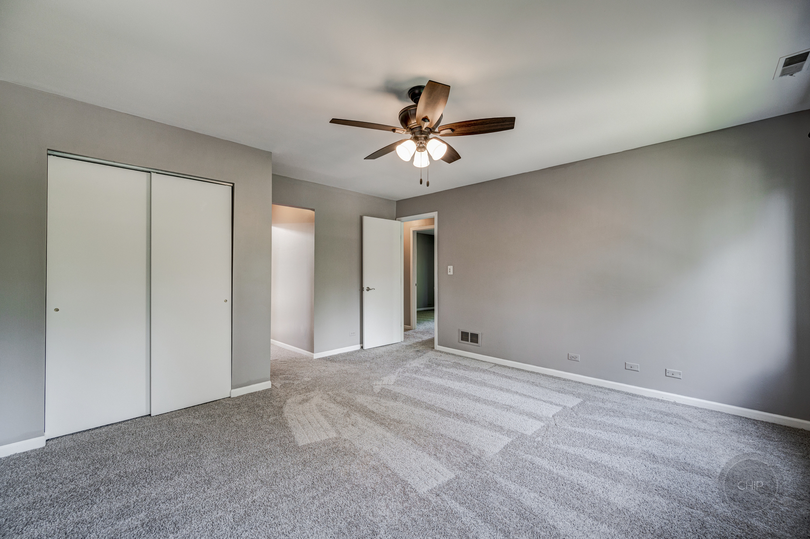 985 West Court, Unit D Naperville, IL 60563 - Photo 18 of 29 a view of a livingroom with a ceiling fan & chandelier fan