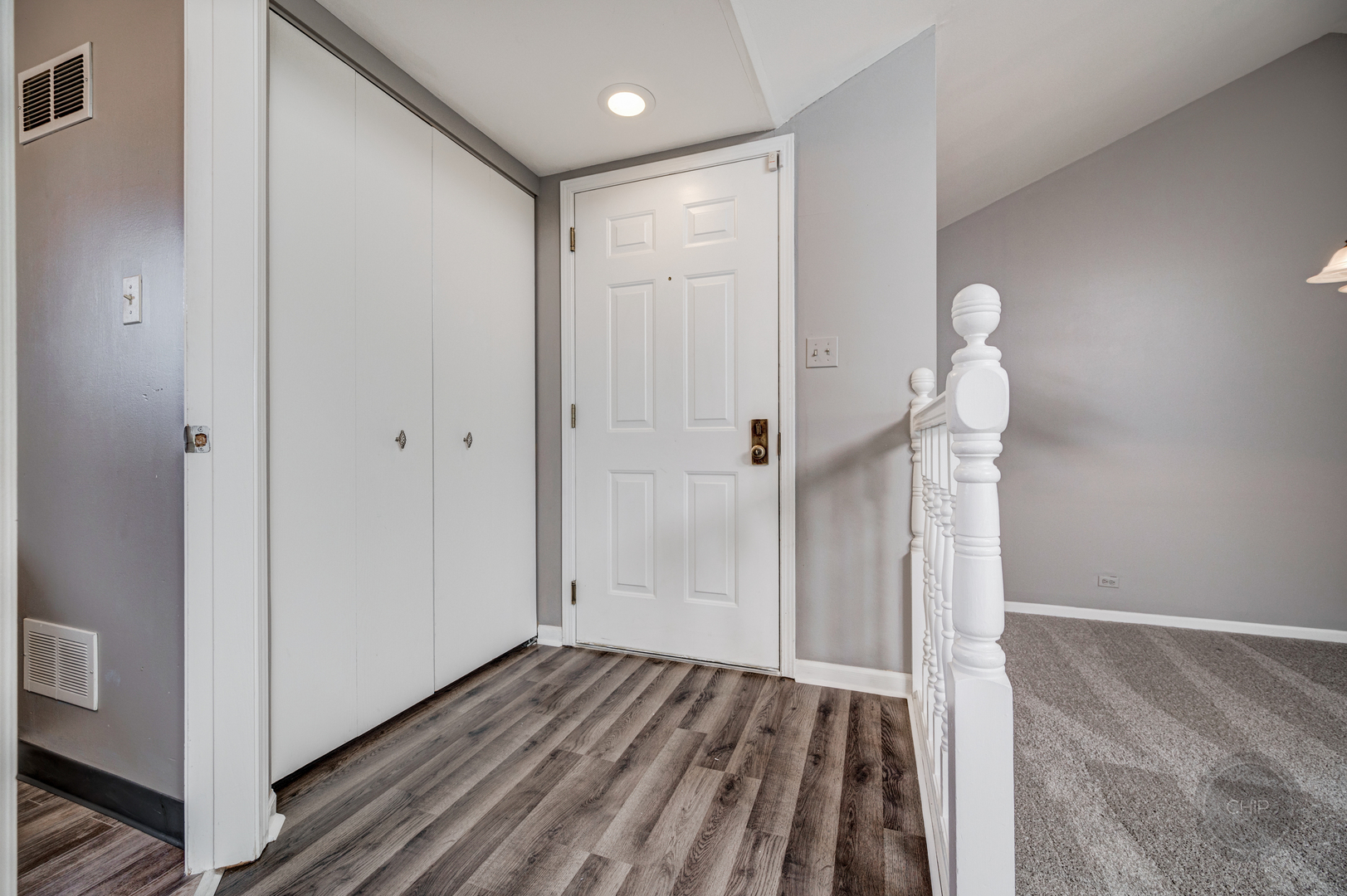 985 West Court, Unit D Naperville, IL 60563 - Photo 3 of 29 a view of hallway with wooden floor