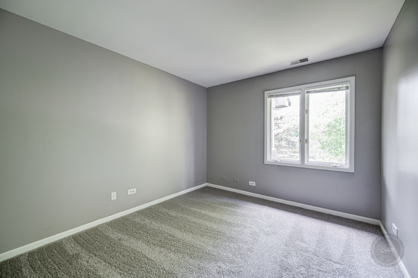 985 West Court, Unit D Naperville, IL 60563 - Photo 22 of 29 an empty room with windows