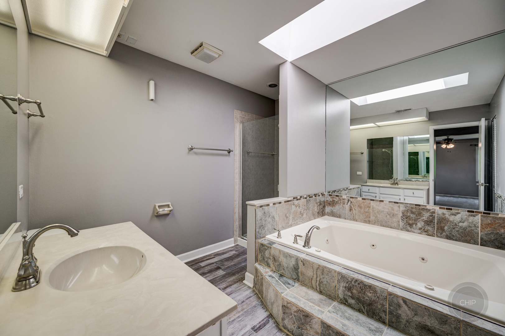 985 West Court, Unit D Naperville, IL 60563 - Photo 23 of 29 a bathroom with a tub and sink