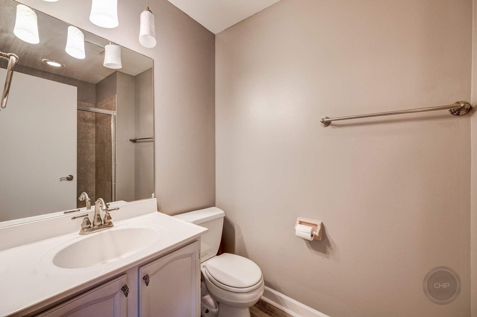 985 West Court, Unit D Naperville, IL 60563 - Photo 25 of 29 a bathroom with a sink toilet and vanity