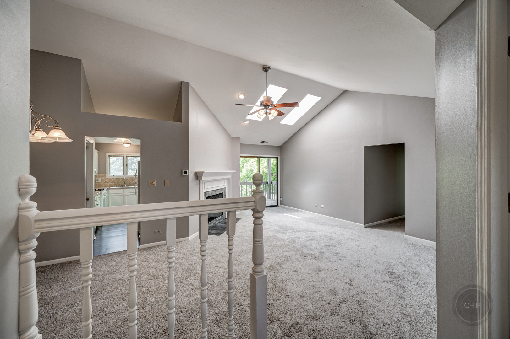 985 West Court, Unit D Naperville, IL 60563 - Photo 4 of 29 a view of a livingroom with furniture a chandelier and wooden floor