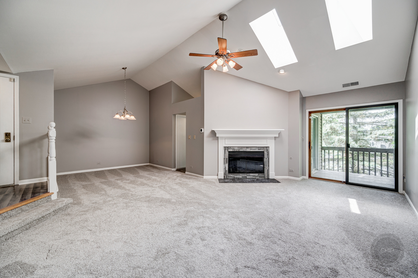 985 West Court, Unit D Naperville, IL 60563 - Photo 7 of 29 an empty room with windows and fireplace