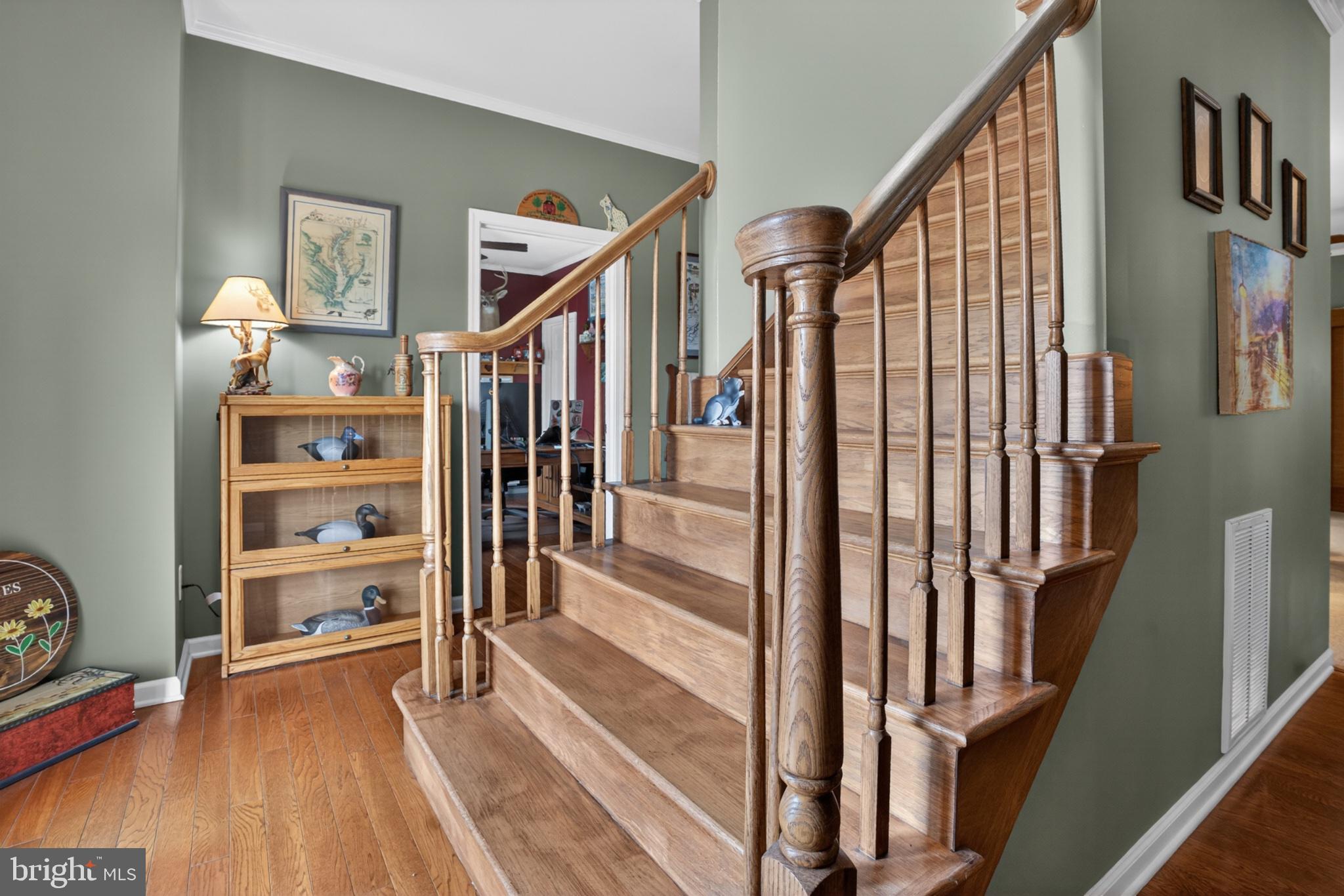 2435 Payne Road Pocomoke City, MD 21851 - Photo 22 of 75 Inviting staircase with warm wood tones.