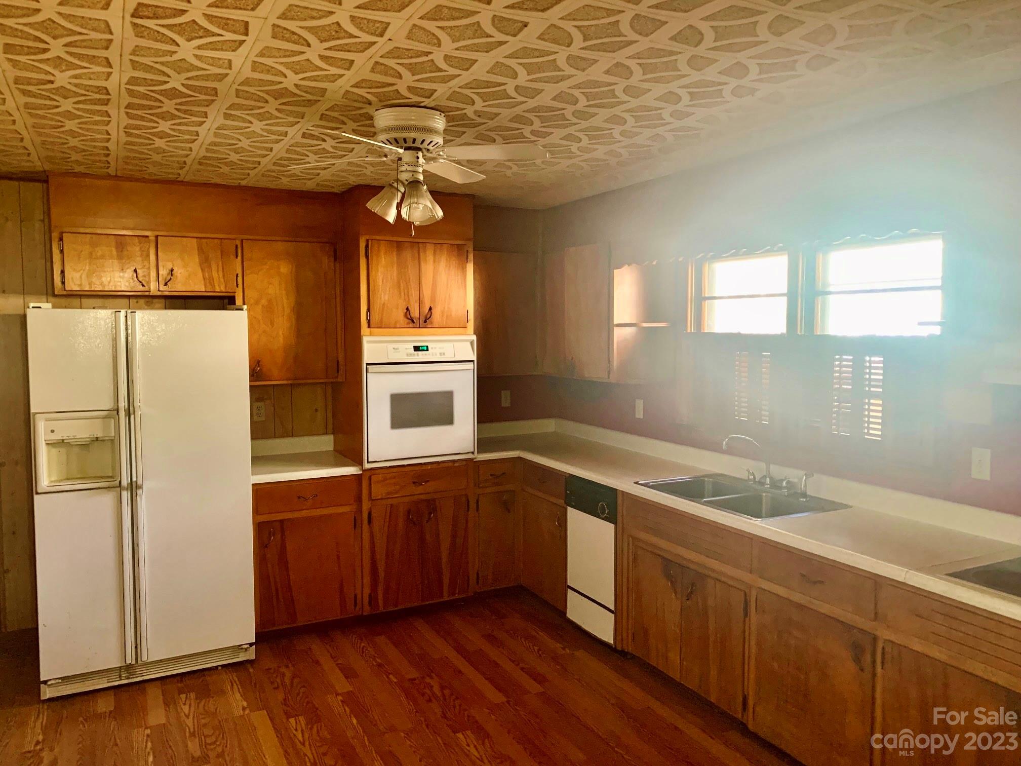 235 Log Cabin Road Waynesville, NC 28786 - Photo 8 of 23 a kitchen that has a sink a refrigerator and window
