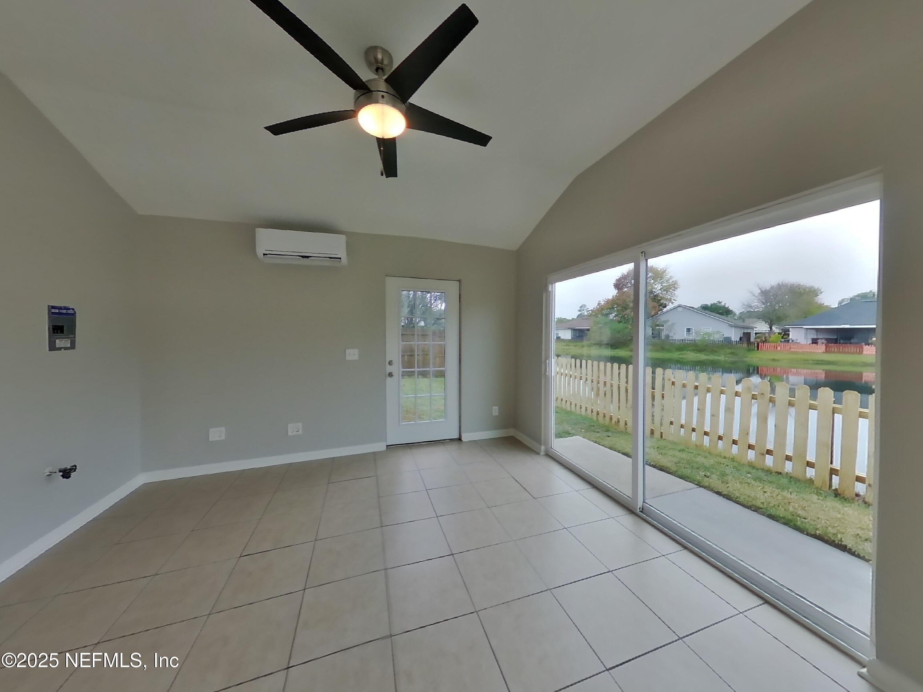 1695 Northglen Circle Middleburg, FL 32068 - Photo 12 of 14 a view of a livingroom with a ceiling fan and window