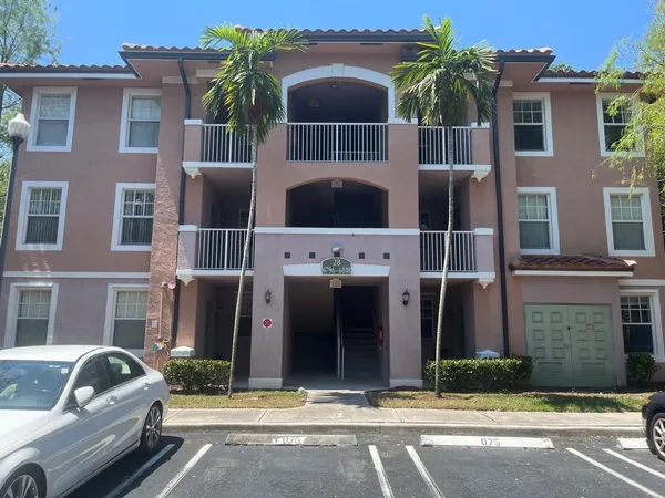 a front view of house with parking space