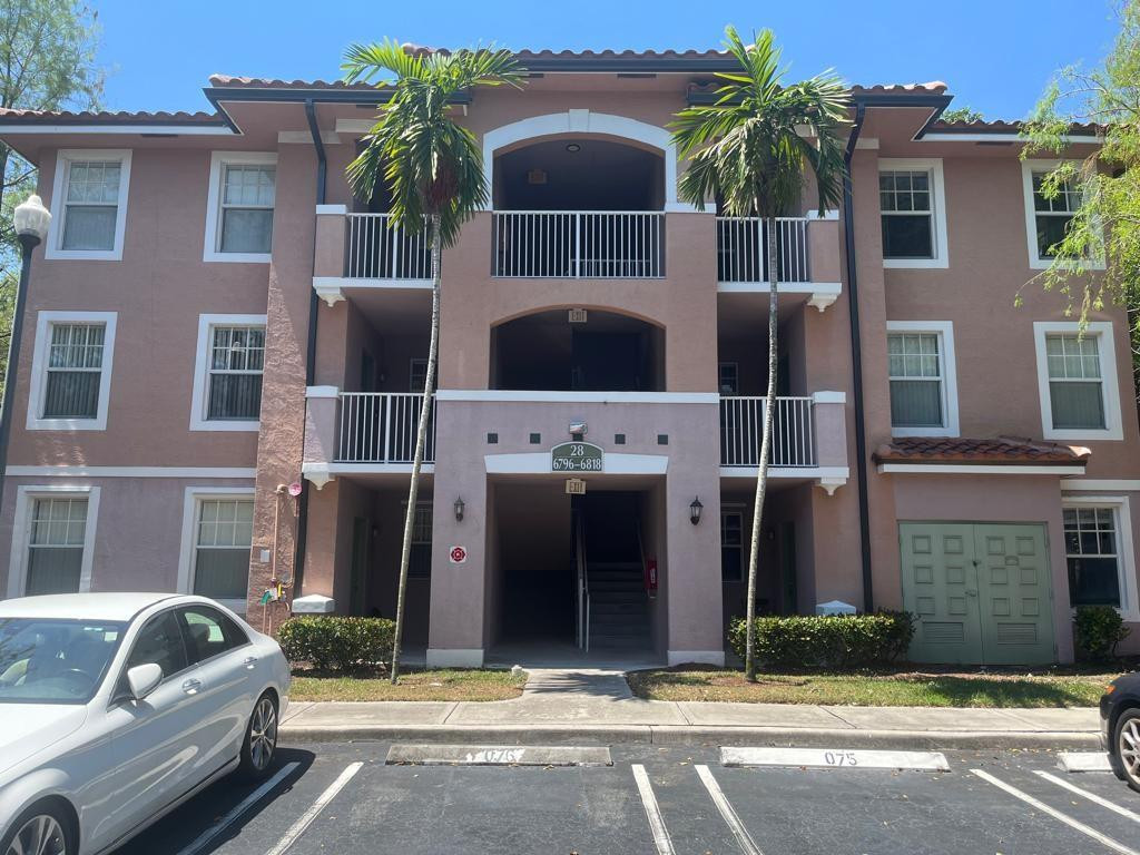 a front view of house with parking space