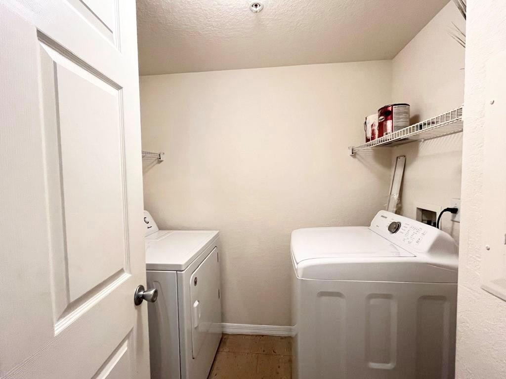 6812 West Sample Road, Unit 6812 Coral Springs, FL 33067 - Photo 11 of 27 a utility room with dryer and washer