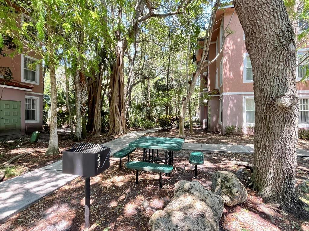 6812 West Sample Road, Unit 6812 Coral Springs, FL 33067 - Photo 20 of 27 a view of outdoor space yard and patio