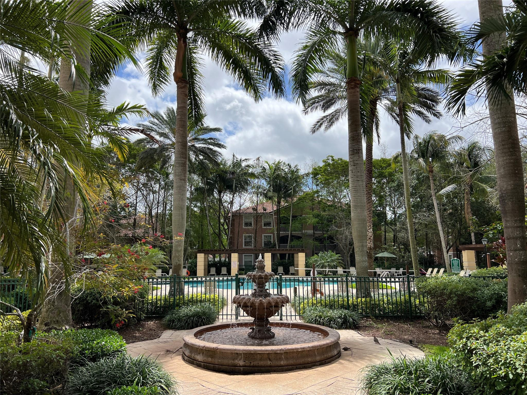 6812 West Sample Road, Unit 6812 Coral Springs, FL 33067 - Photo 25 of 27 a view of a fountain in the garden
