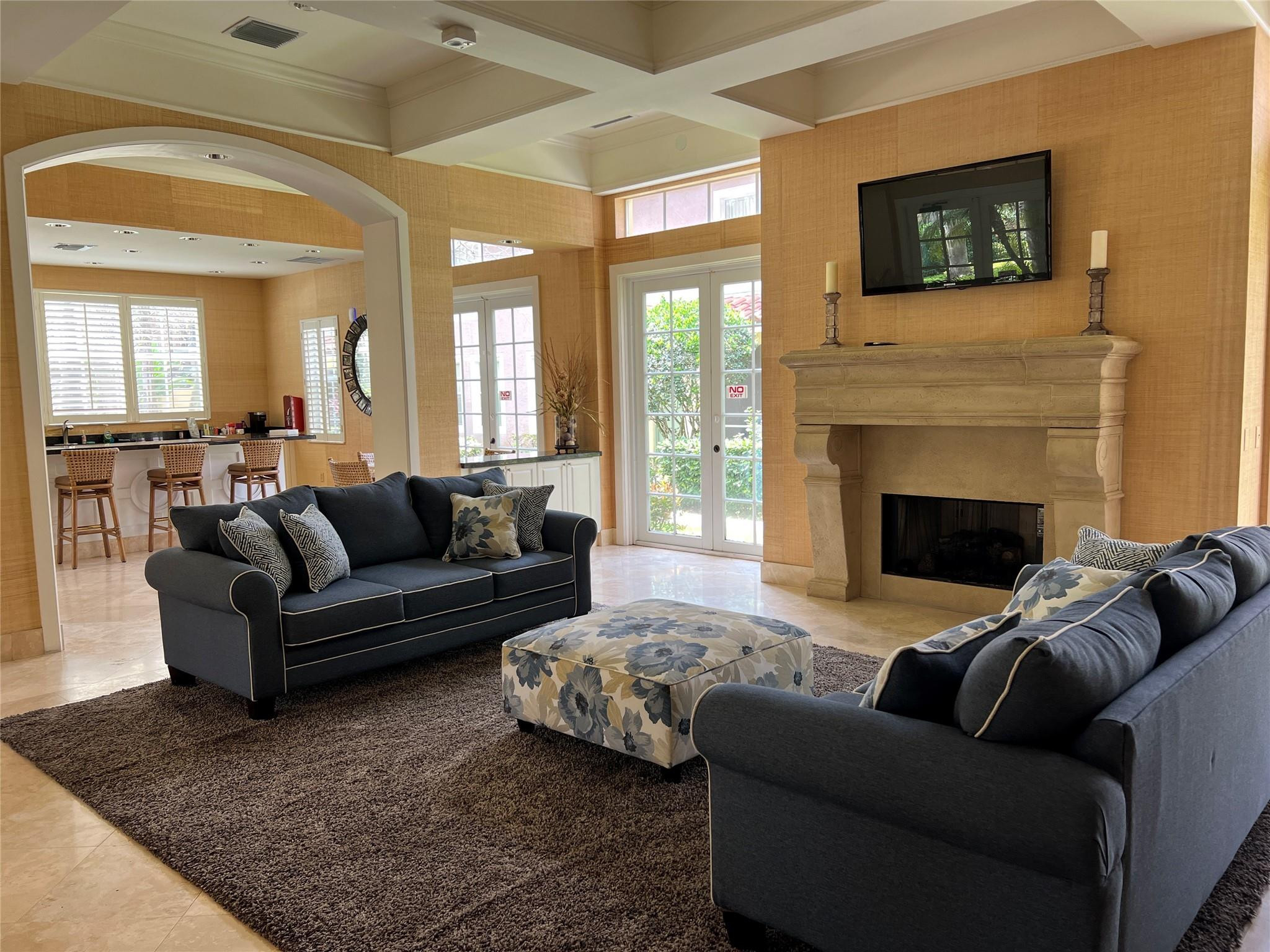 6812 West Sample Road, Unit 6812 Coral Springs, FL 33067 - Photo 26 of 27 a living room with furniture and a fireplace