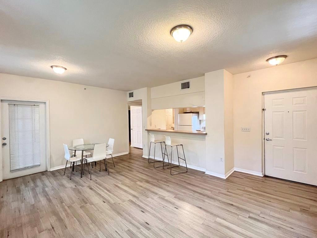 6812 West Sample Road, Unit 6812 Coral Springs, FL 33067 - Photo 5 of 27 a view of a livingroom with furniture and wooden floor