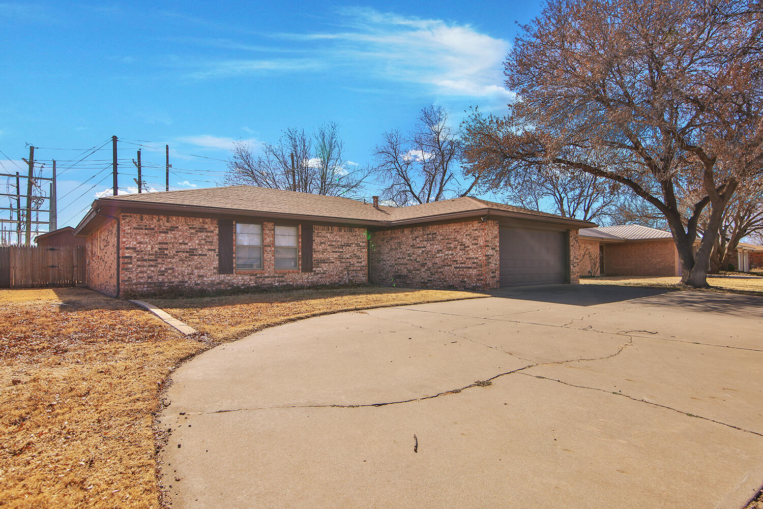 4805 73rd Street Lubbock, TX 79424 - Photo 4 of 26 a front view of a house with a yard
