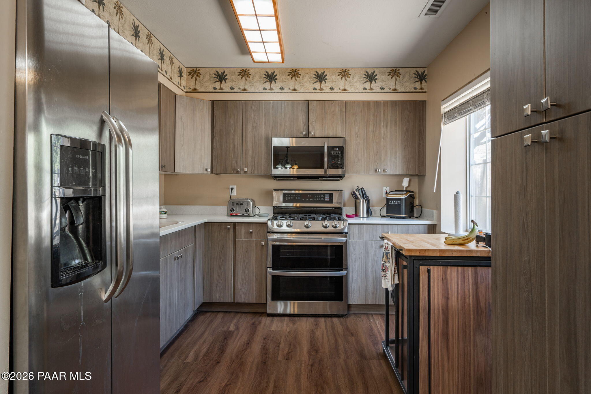 1710 Grandview Road Prescott, AZ 86305 - Photo 11 of 47 a kitchen with stainless steel appliances a refrigerator sink and microwave