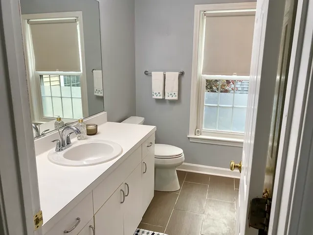 a bathroom with a bathtub and window