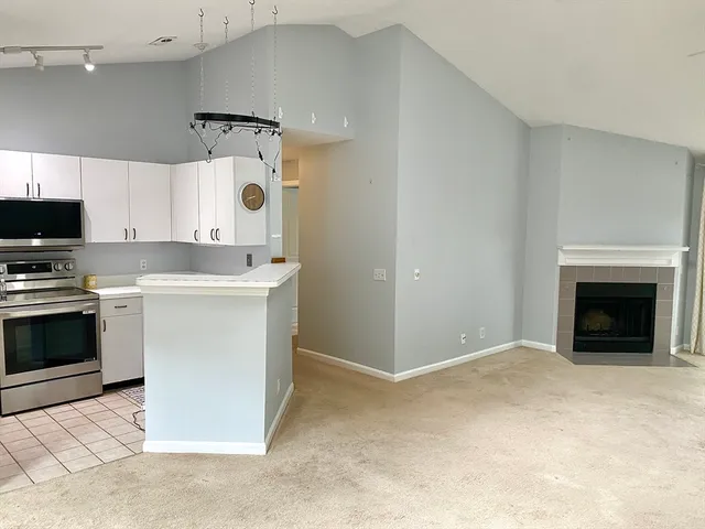 a kitchen with a stove and a refrigerator