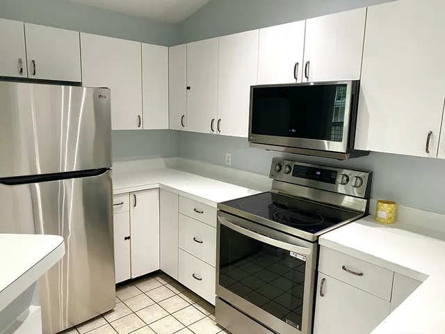 a kitchen with a stove and a microwave