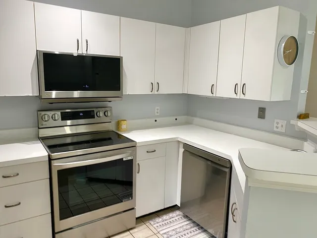 a kitchen with a stove and a microwave