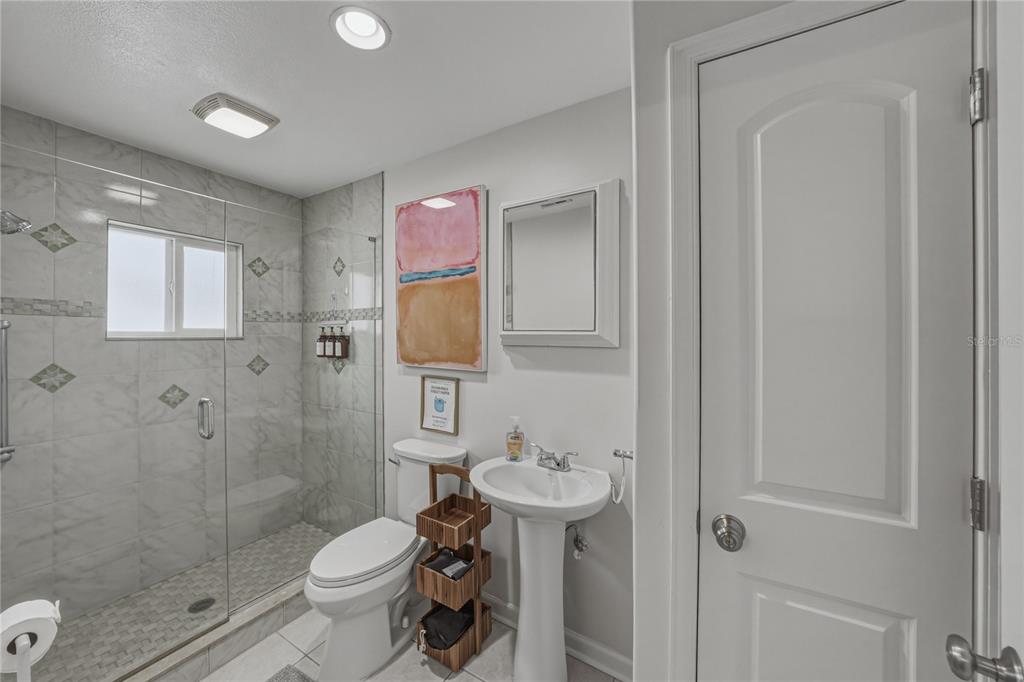 1004 Sago Palm Way Apollo Beach, FL 33572 - Photo 25 of 92 a bathroom with a sink toilet and shower