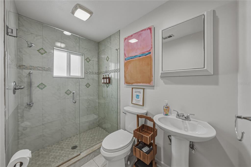 1004 Sago Palm Way Apollo Beach, FL 33572 - Photo 27 of 92 a bathroom with a sink toilet and shower