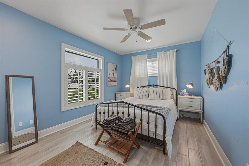 1004 Sago Palm Way Apollo Beach, FL 33572 - Photo 39 of 92 a view of a bedroom with wooden floor