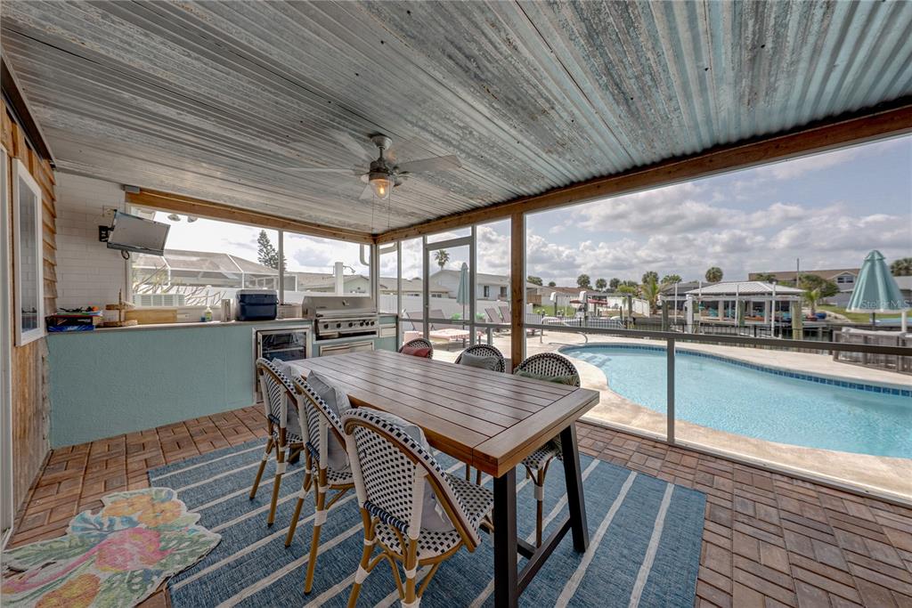 1004 Sago Palm Way Apollo Beach, FL 33572 - Photo 45 of 92 a view of a patio with a table and chairs