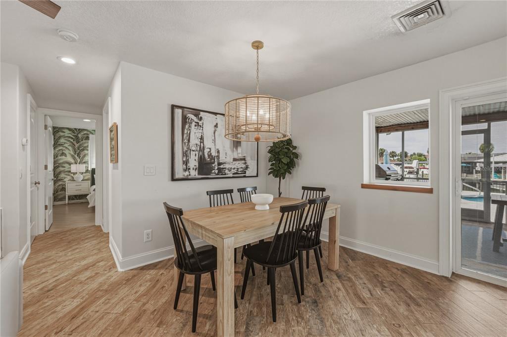 1004 Sago Palm Way Apollo Beach, FL 33572 - Photo 10 of 92 a view of a dining room with furniture window and wooden floor