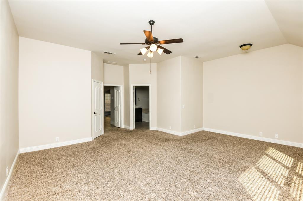 826 Graham Drive Burleson, TX 76028 - Photo 11 of 18 a view of an empty room with a ceiling fan
