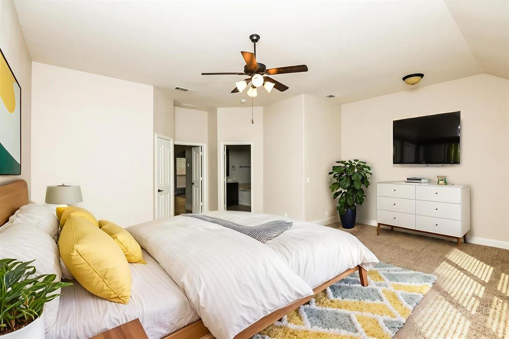 826 Graham Drive Burleson, TX 76028 - Photo 12 of 18 a bedroom with a bed window and a flat screen tv