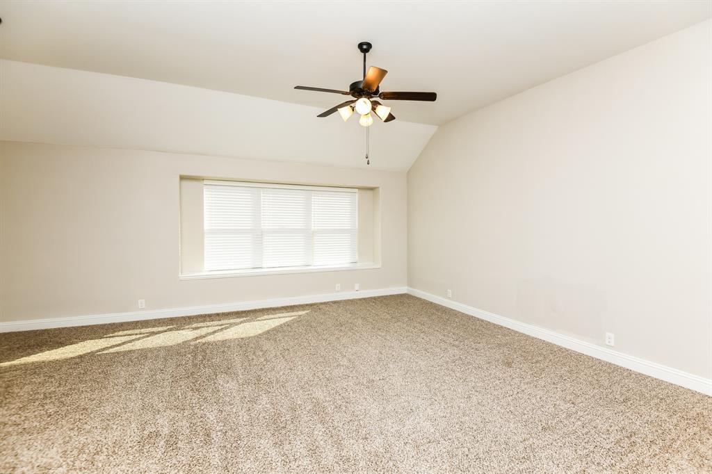 826 Graham Drive Burleson, TX 76028 - Photo 14 of 18 an empty room with windows and fan
