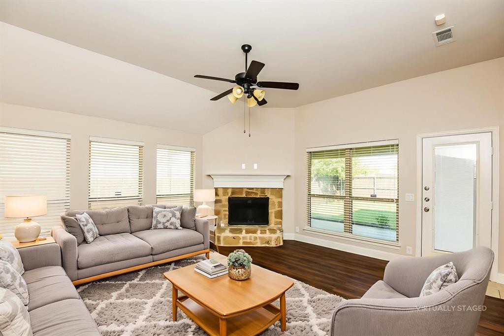 826 Graham Drive Burleson, TX 76028 - Photo 3 of 18 a living room with furniture fireplace and window