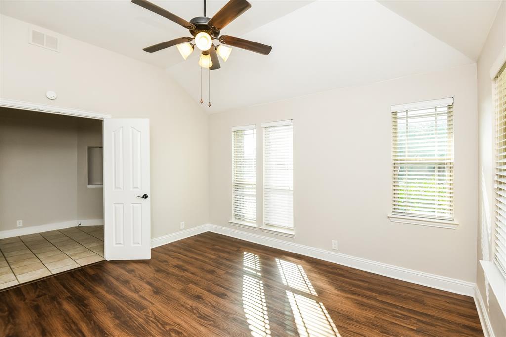 826 Graham Drive Burleson, TX 76028 - Photo 9 of 18 a view of empty room with wooden floor and fan