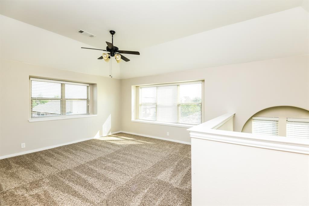 826 Graham Drive Burleson, TX 76028 - Photo 10 of 18 a bedroom with a bed dresser and a window